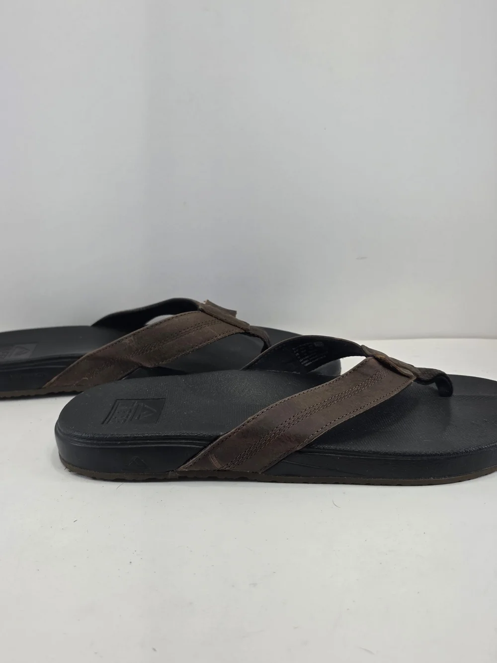Reef Men's Black Footbed Brown Strap Flip Flop Sandals